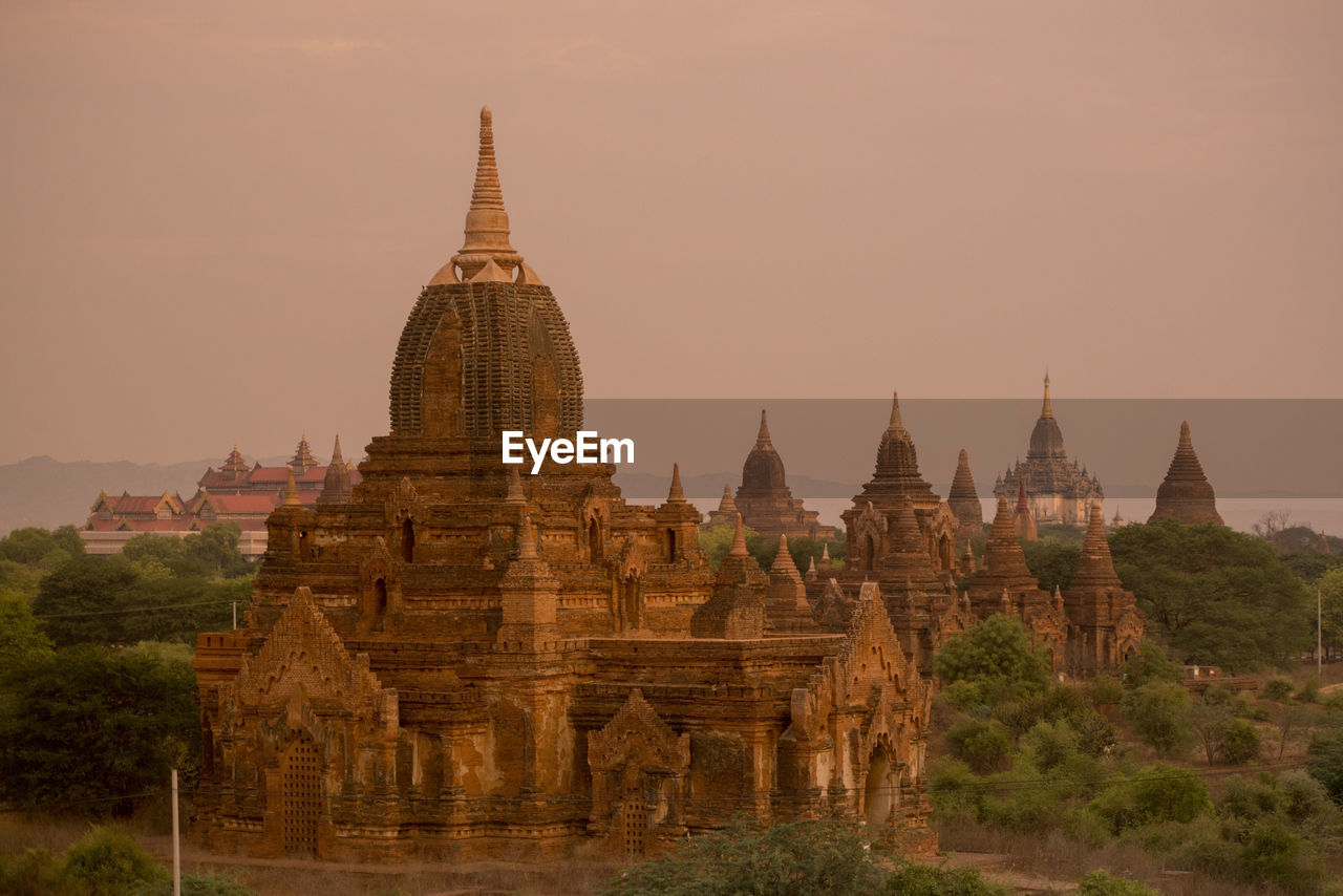 Historic temple against sky during sunset