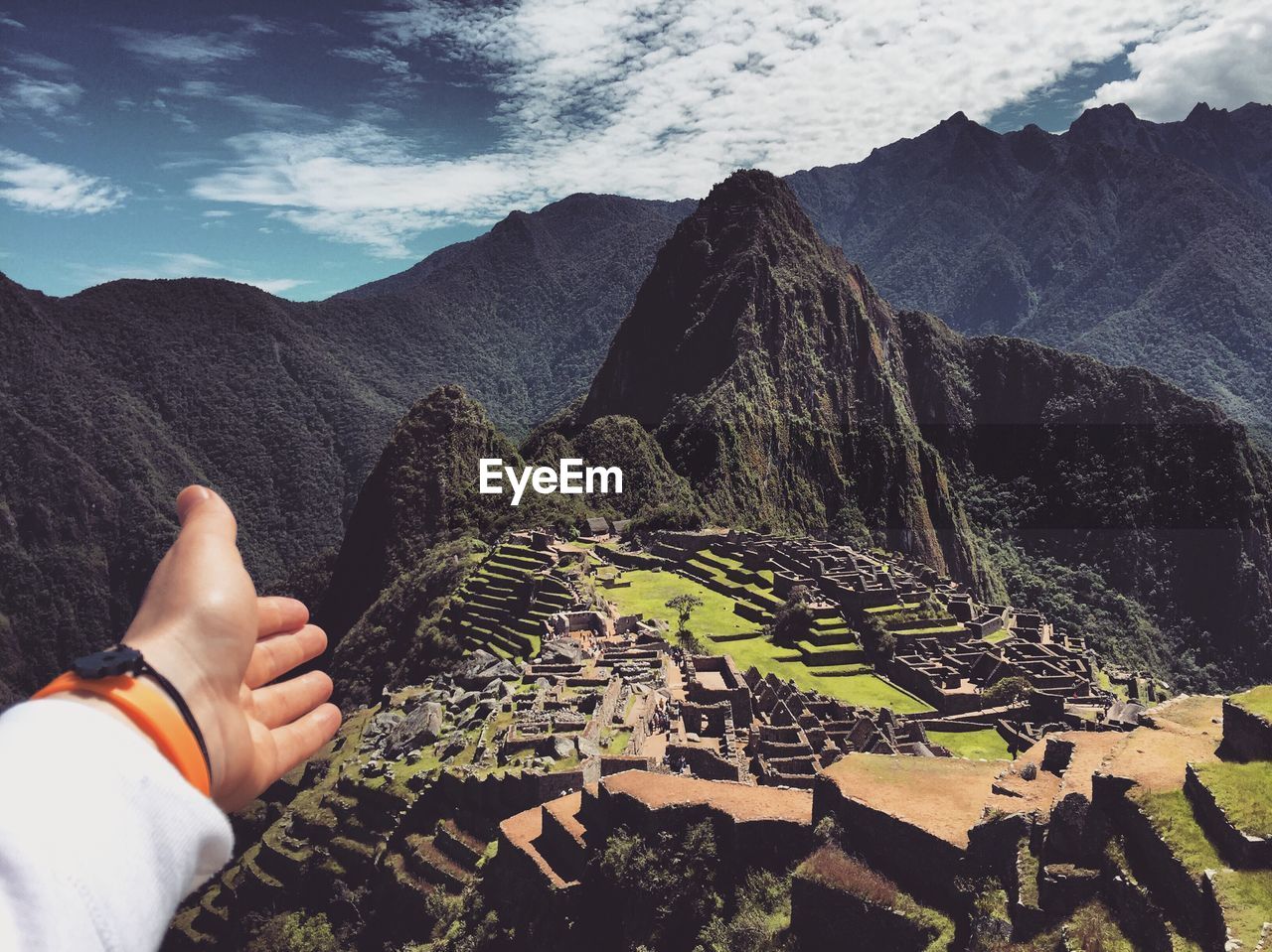 Scenic view of ancient village on mountain against cloudy sky