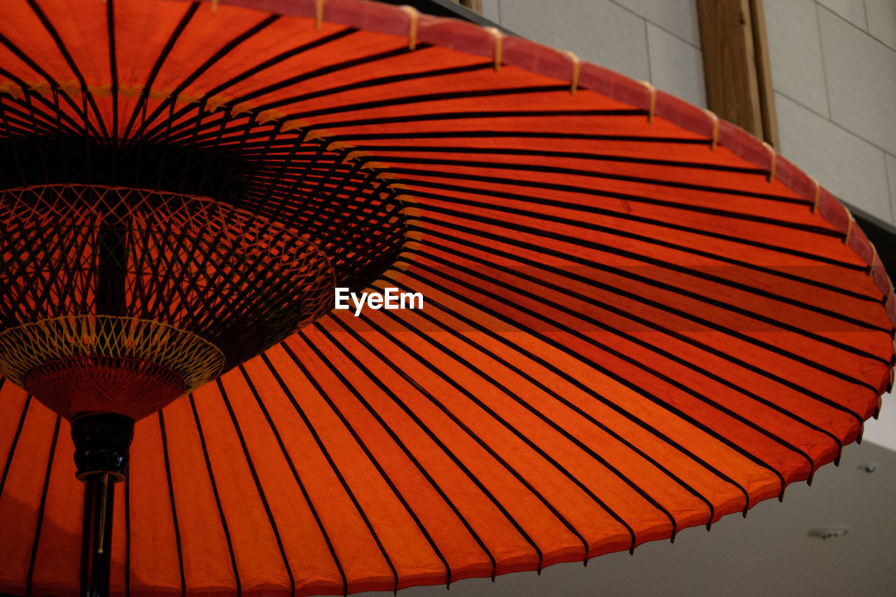 Low angle view of red japanese umbrella