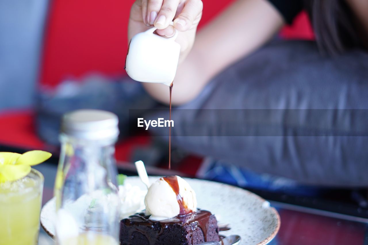 Close-up of hand holding ice cream