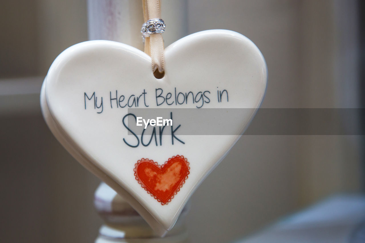 CLOSE-UP OF HEART SHAPE MADE OF BREAD ON TABLE