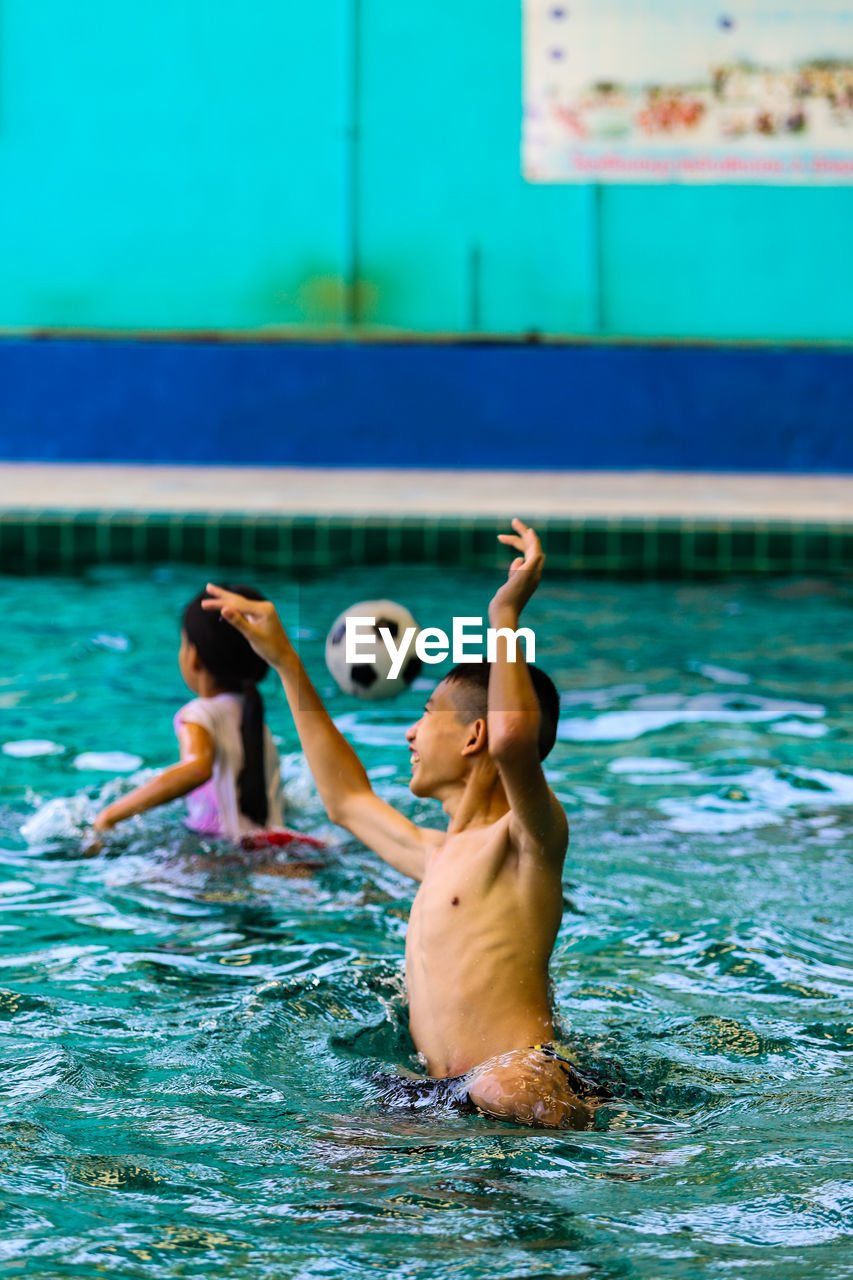 Man swimming in pool