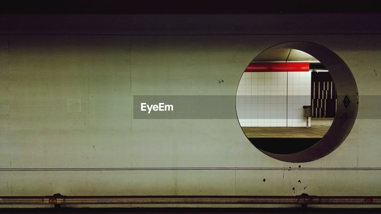 Subway platform seen through hole