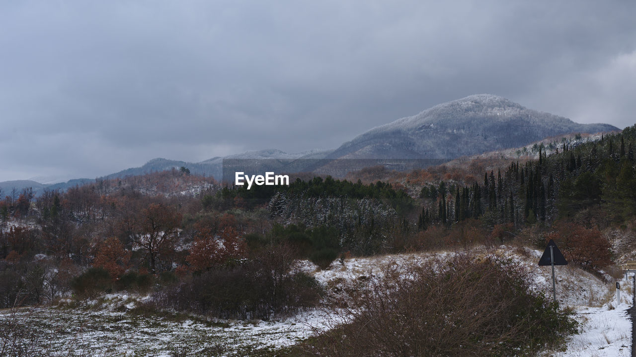 Scenic view of mountains against sky during winter