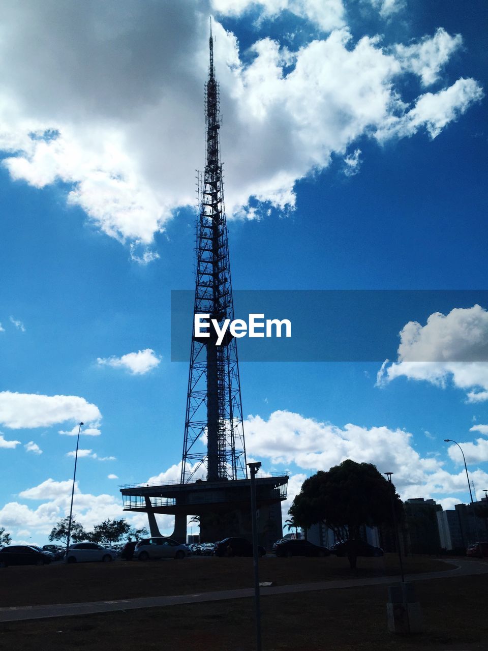 Low angle view of crane against blue sky