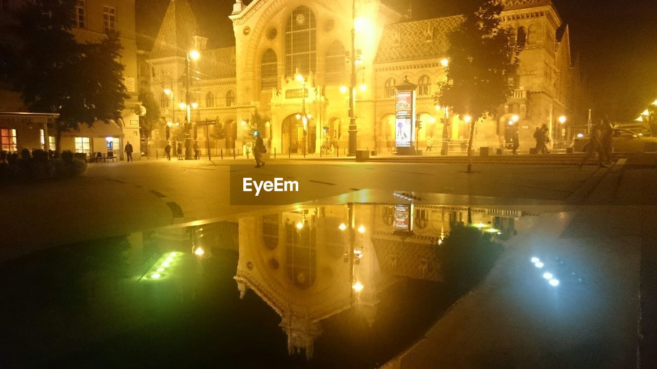 ILLUMINATED CITY STREET AT NIGHT