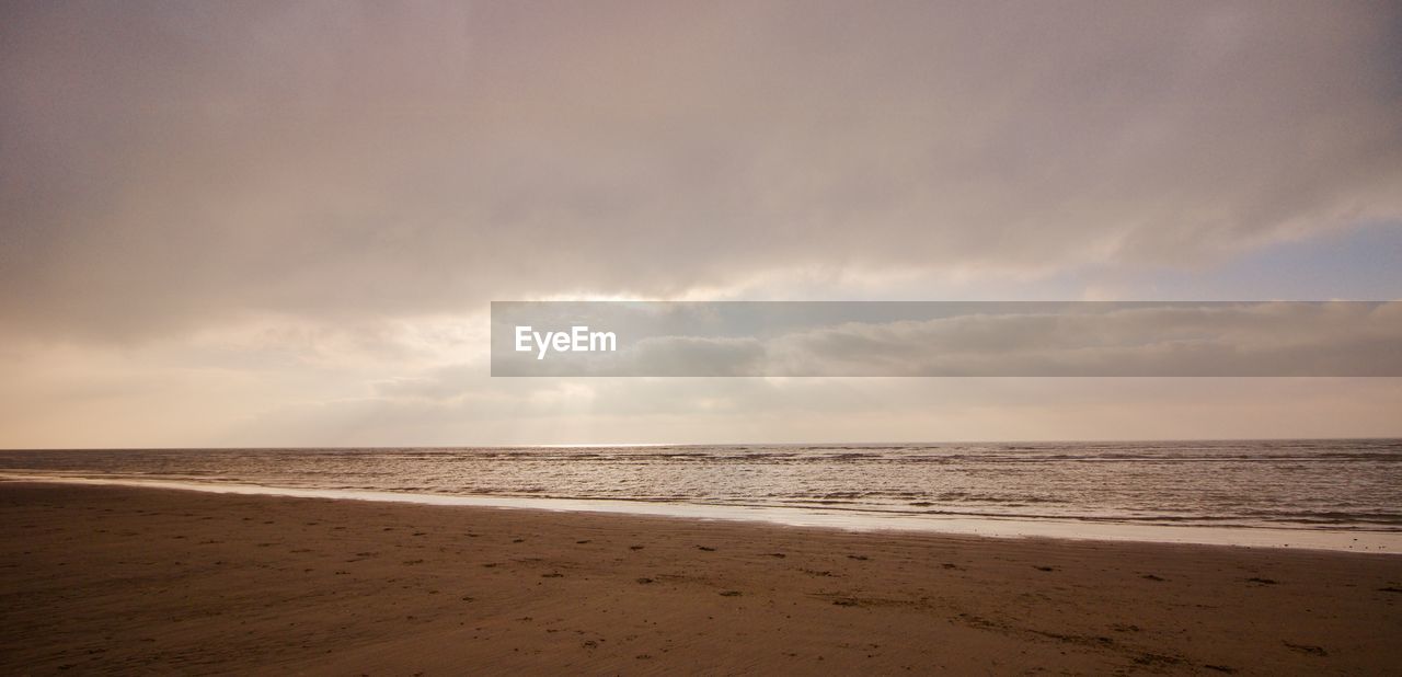 VIEW OF BEACH AGAINST SKY