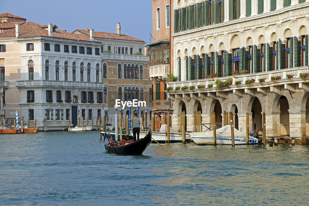 A romantic gondola tour along the grand canal. venice, italy, june 2021.