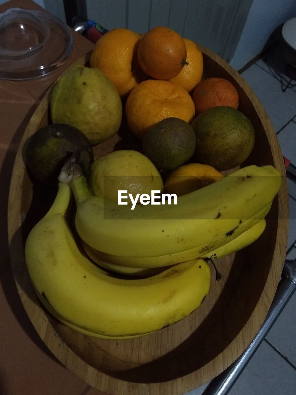 HIGH ANGLE VIEW OF FRUITS IN CONTAINER ON TABLE