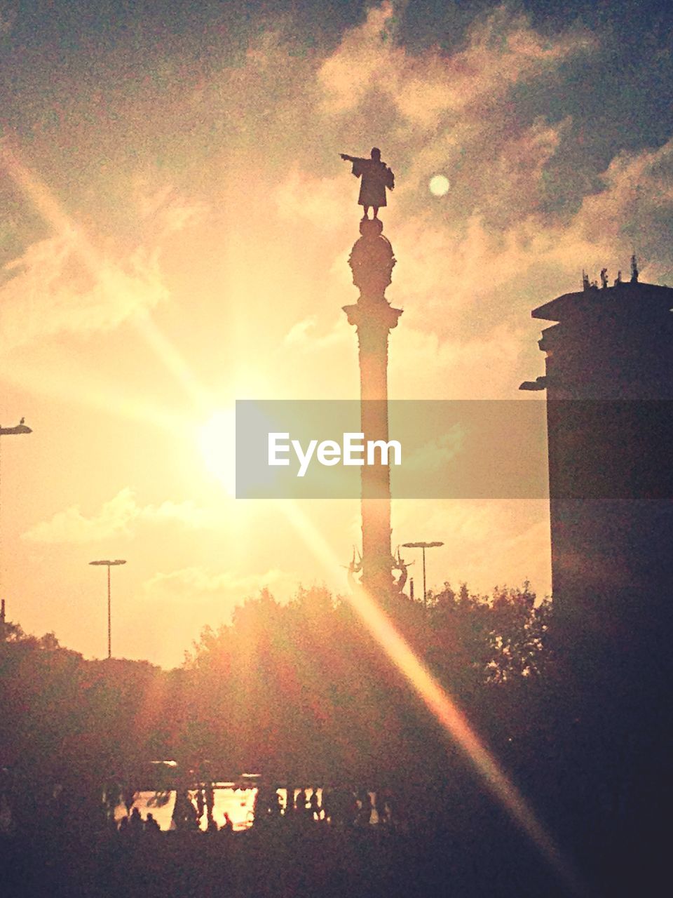 Silhouette of statue at sunset 