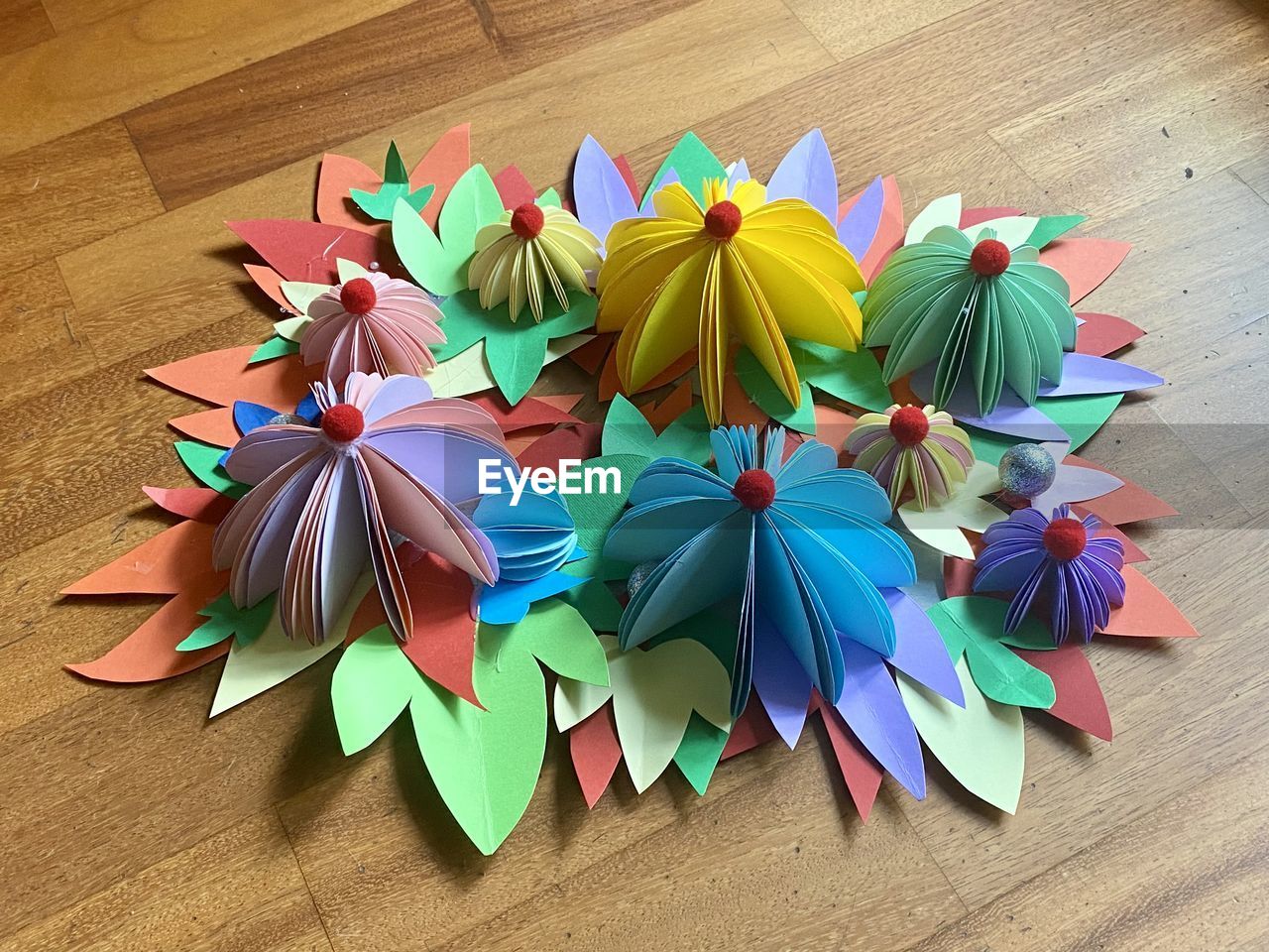 multi colored, wheel, origami, art, origami paper, no people, creativity, large group of objects, paper, wood, high angle view, indoors, art paper, variation, craft, still life, table, flower