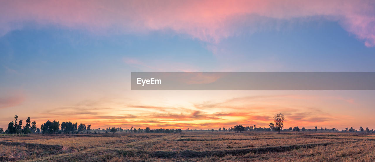 PANORAMIC VIEW OF LAND AGAINST SKY DURING SUNSET