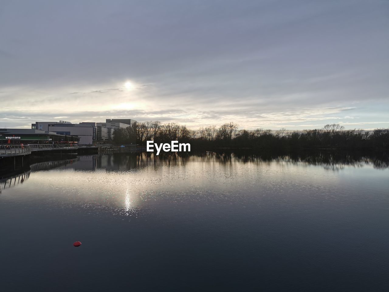 REFLECTION OF SKY ON LAKE DURING SUNSET