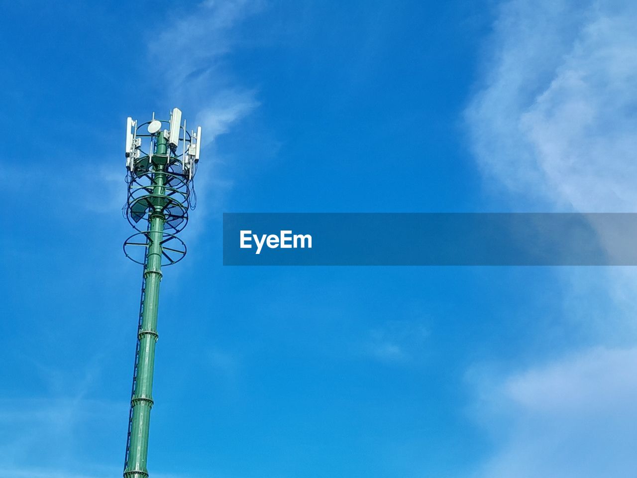 low angle view of street light against blue sky