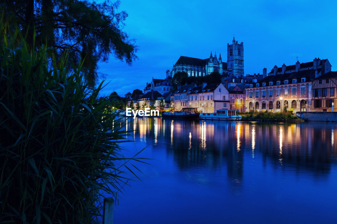 reflection of illuminated buildings in water