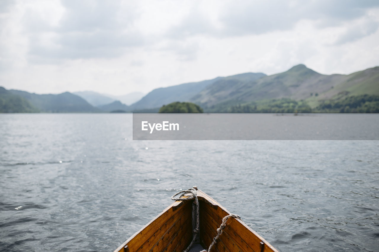 SCENIC VIEW OF LAKE AGAINST MOUNTAINS