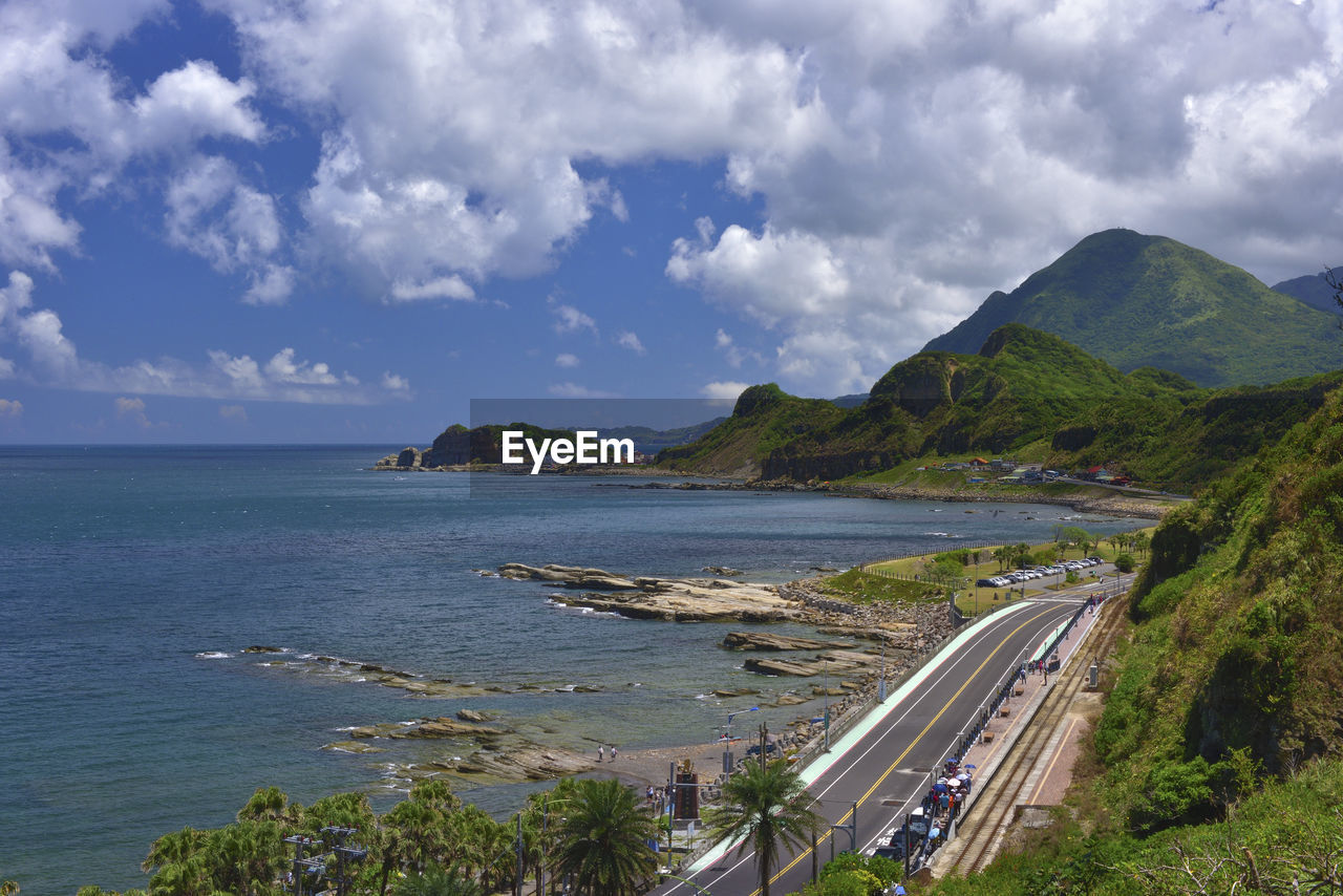 Panoramic view of road by sea against sky