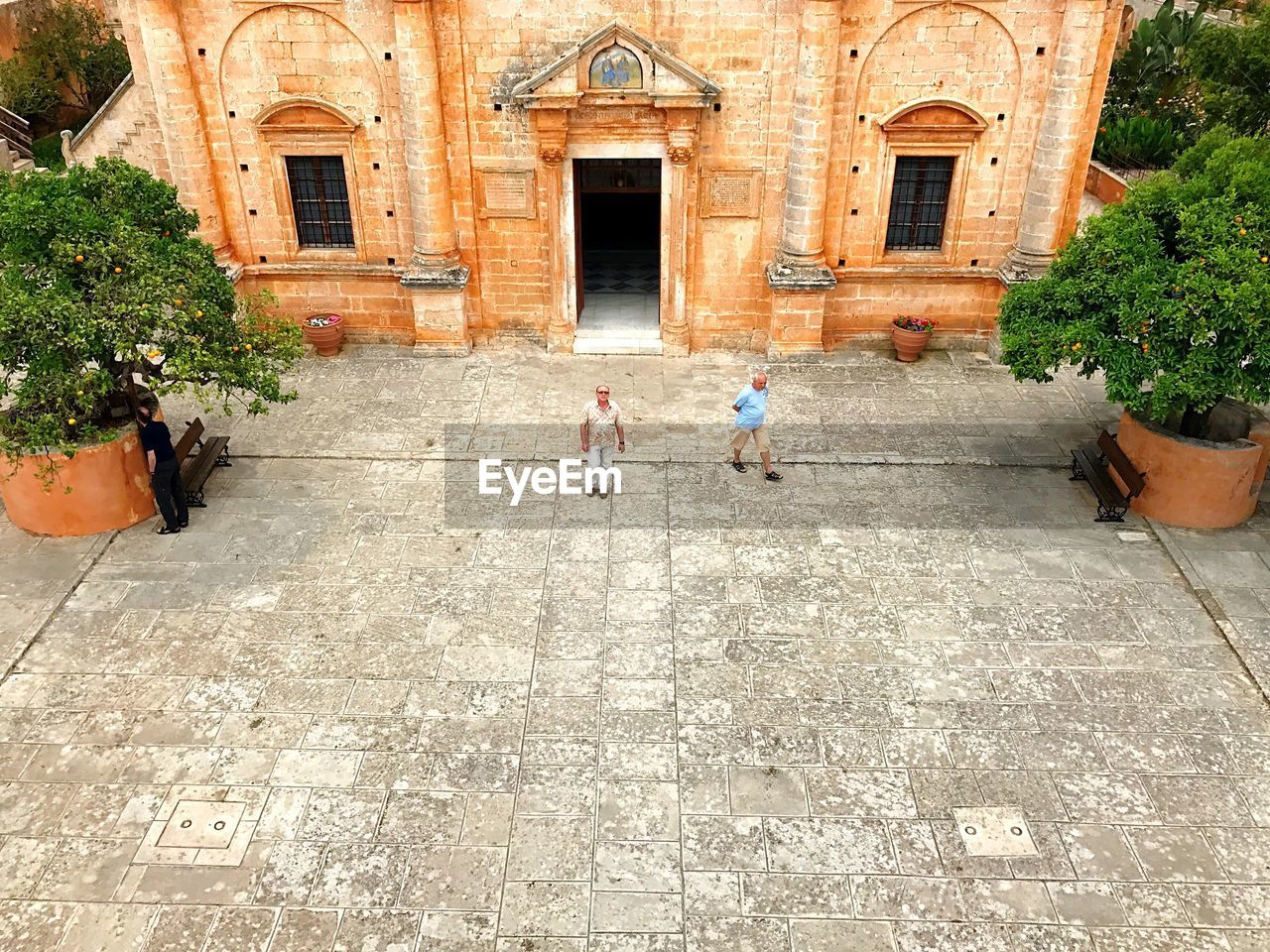 PEOPLE STANDING OUTSIDE BUILDING