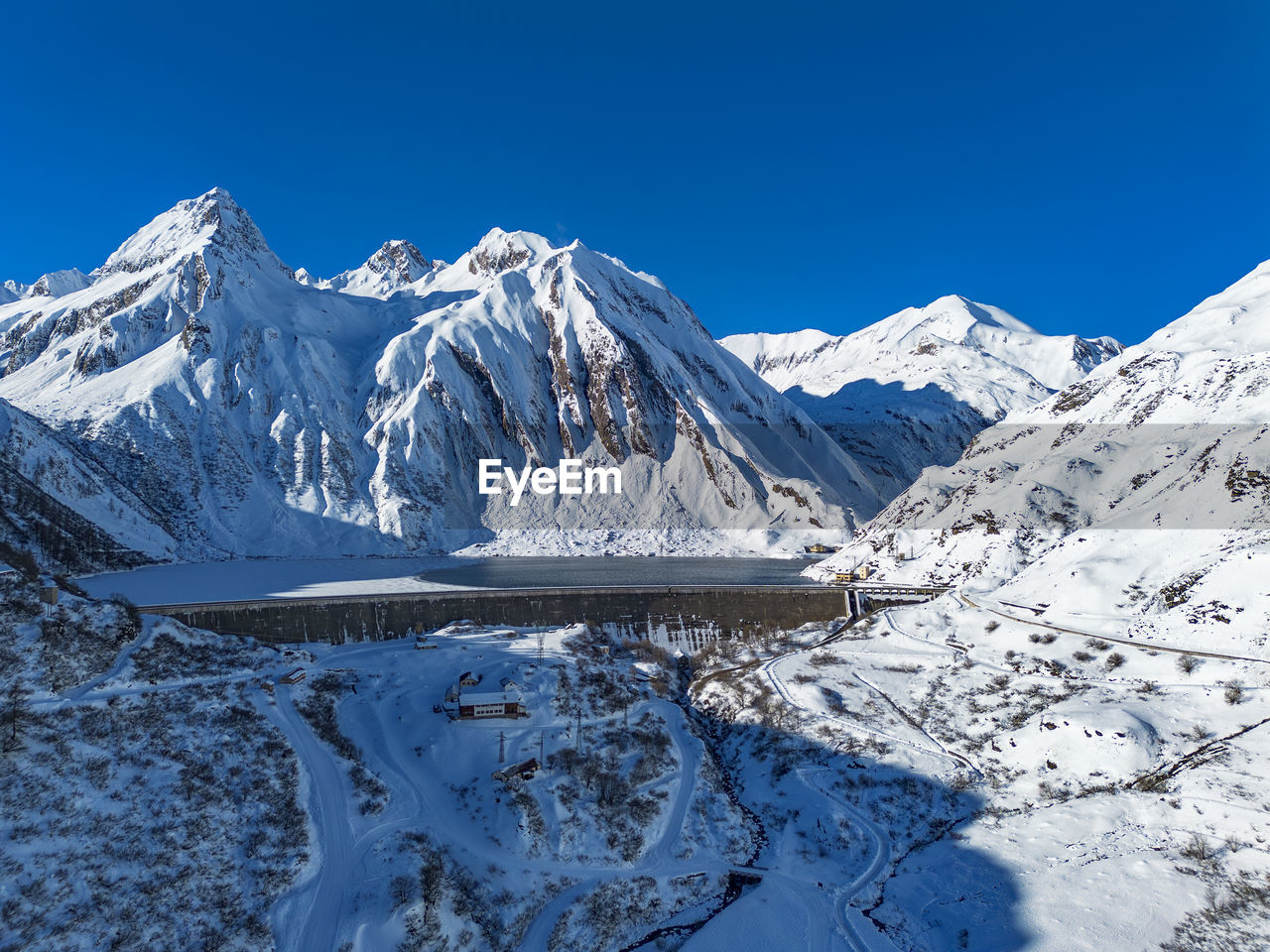 scenic view of snowcapped mountains against clear sky