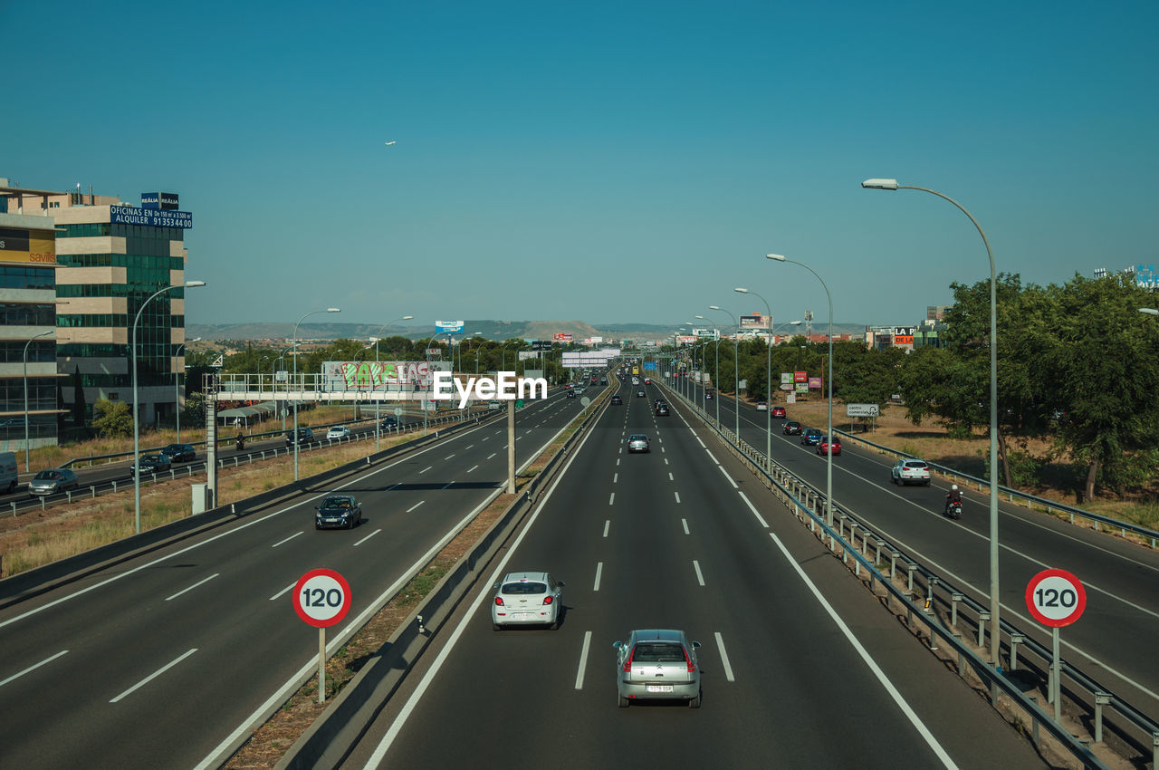 VEHICLES ON HIGHWAY IN CITY