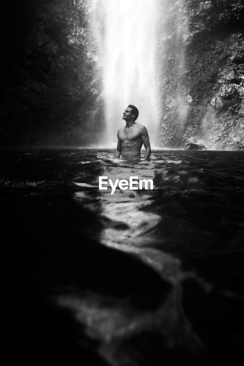 water, black and white, darkness, one person, nature, monochrome photography, monochrome, black, waterfall, swimming, adult, leisure activity, lifestyles, sports, motion, men, outdoors, wet, young adult, beauty in nature, day, sea, holiday, vacation, full length, trip, sunlight, women, emotion, water sports