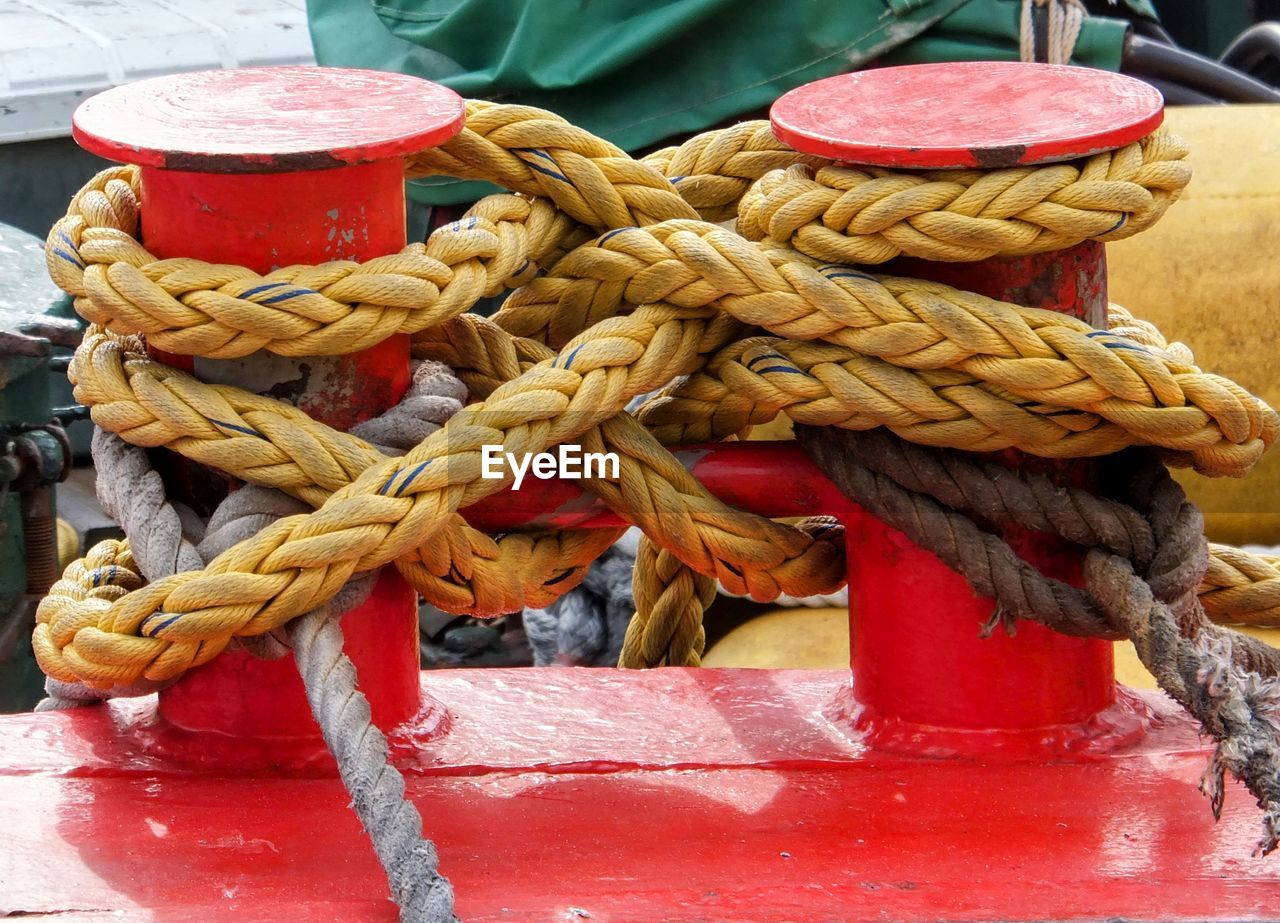 Close-up of rope tied on wooden post