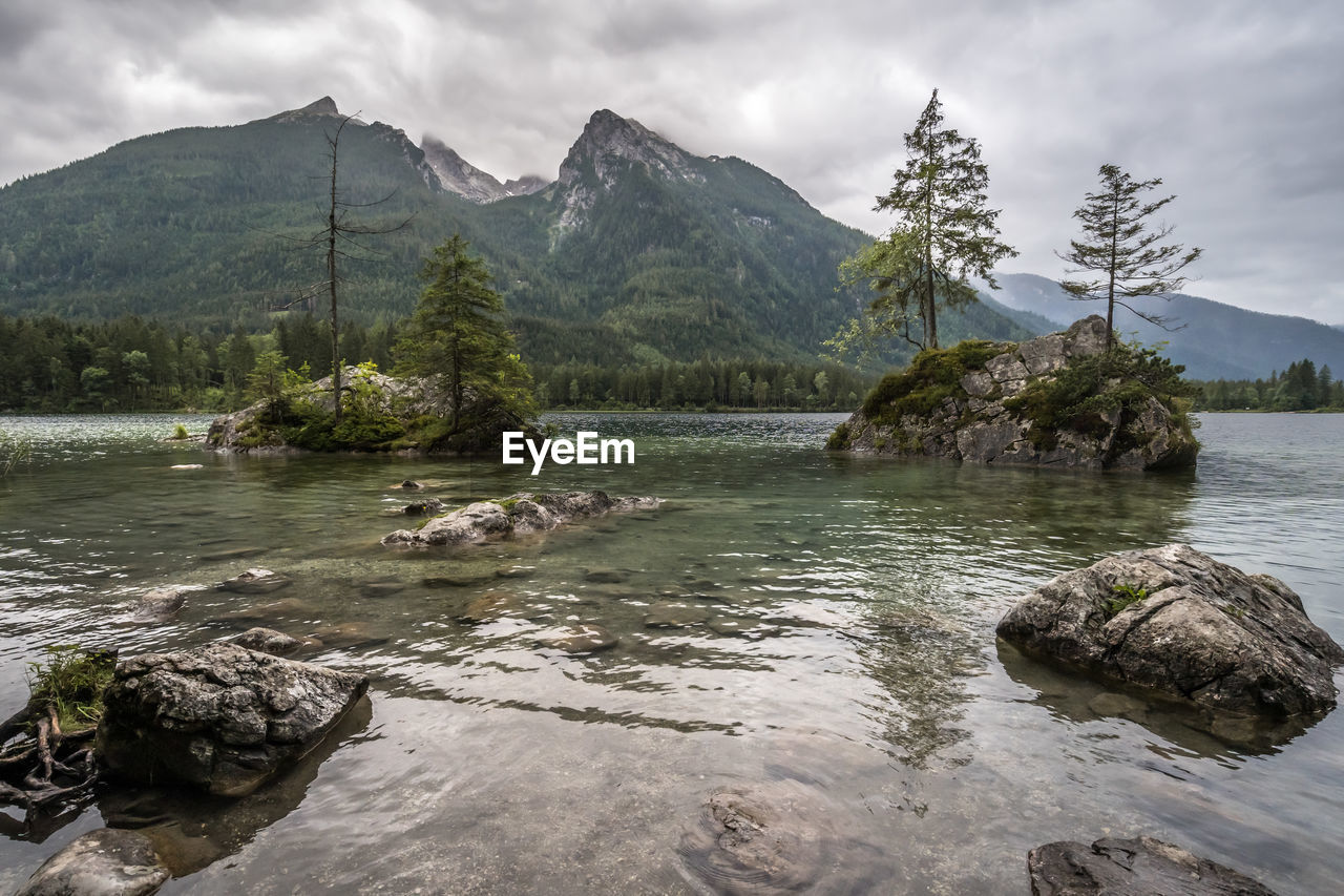 SCENIC VIEW OF RIVER AGAINST MOUNTAIN