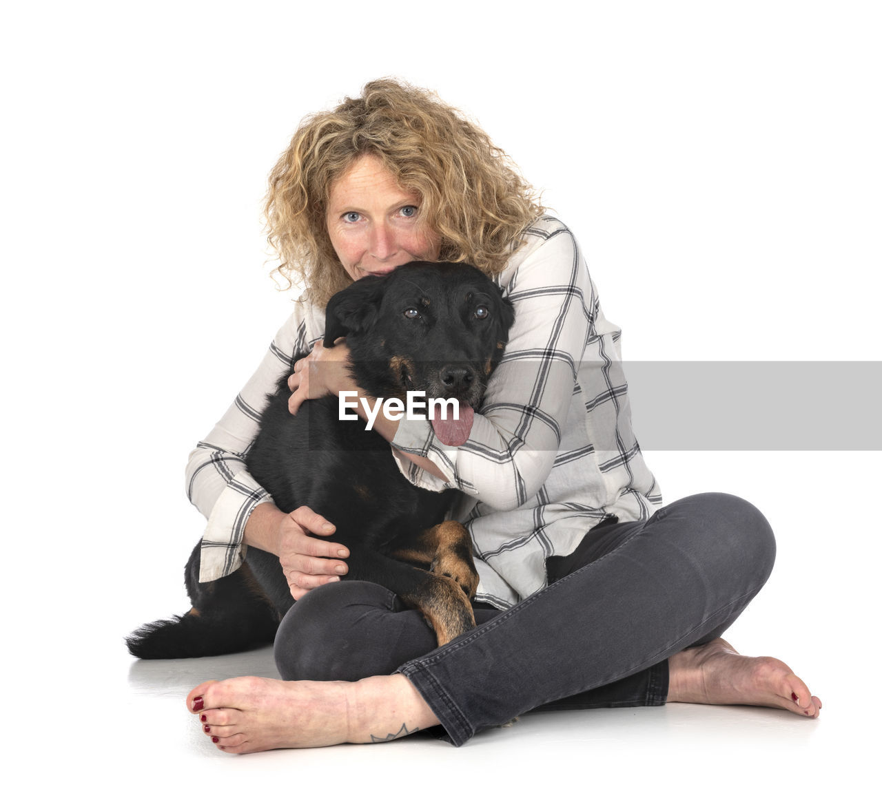 PORTRAIT OF TEENAGE GIRL SITTING WITH DOG