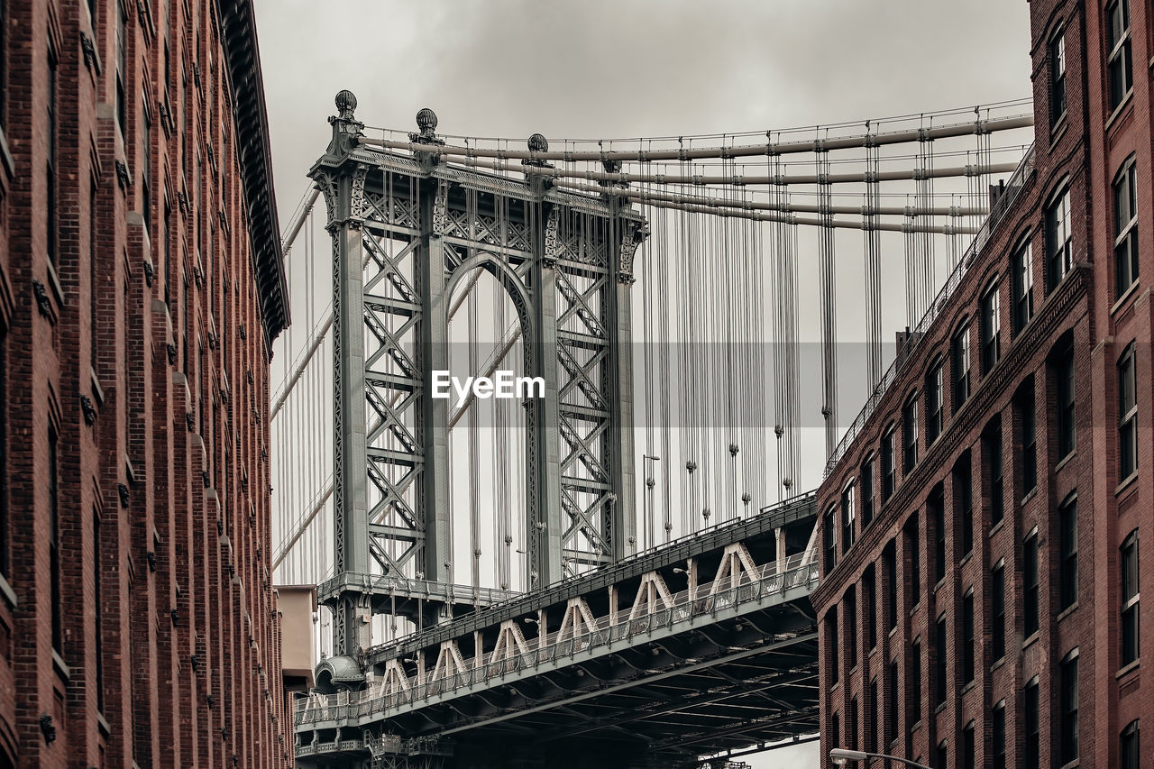 low angle view of bridge in city