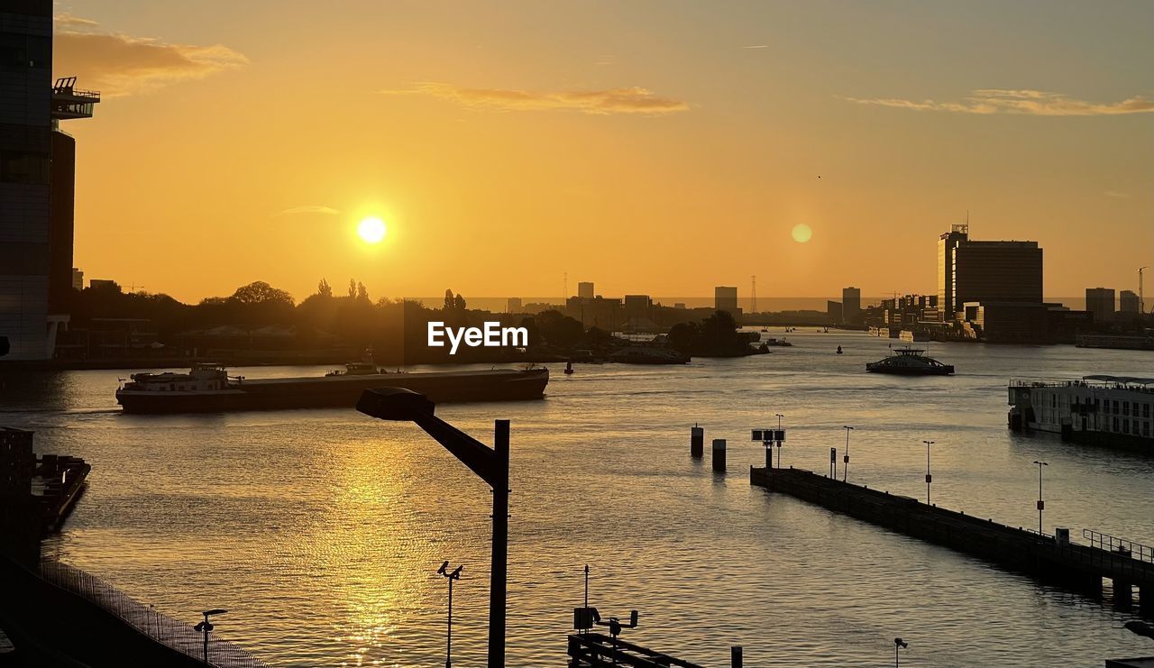 VIEW OF RIVER AGAINST SKY DURING SUNSET