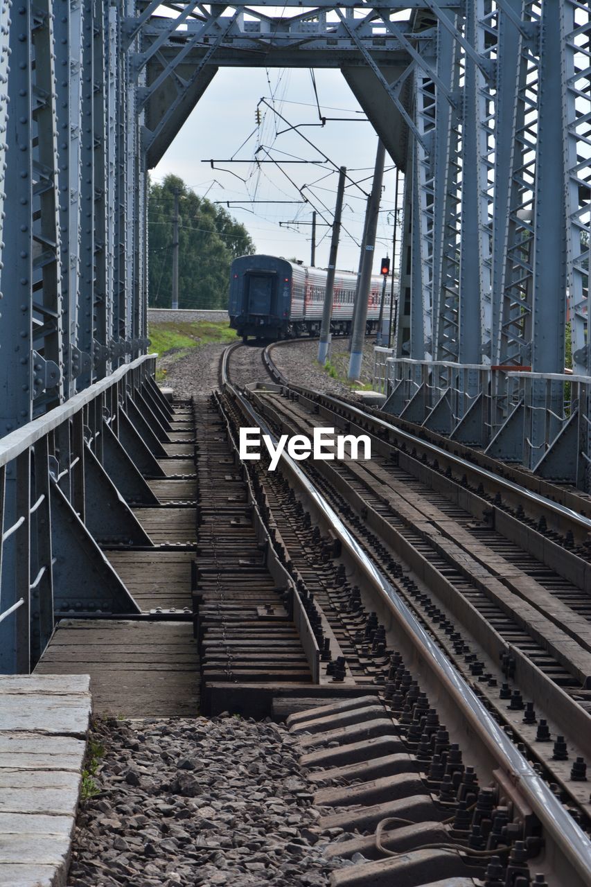 Train on railroad station against sky