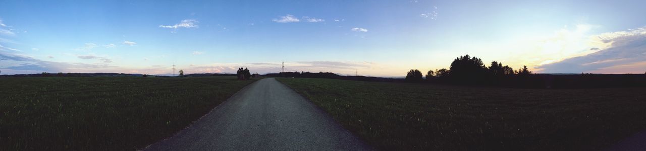 Road amidst landscape against sky