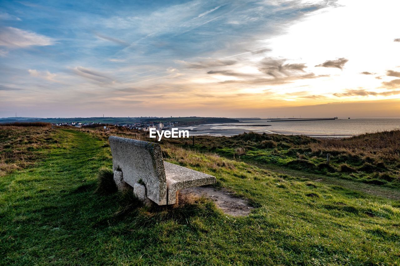 Scenic view of beach against sky during sunset