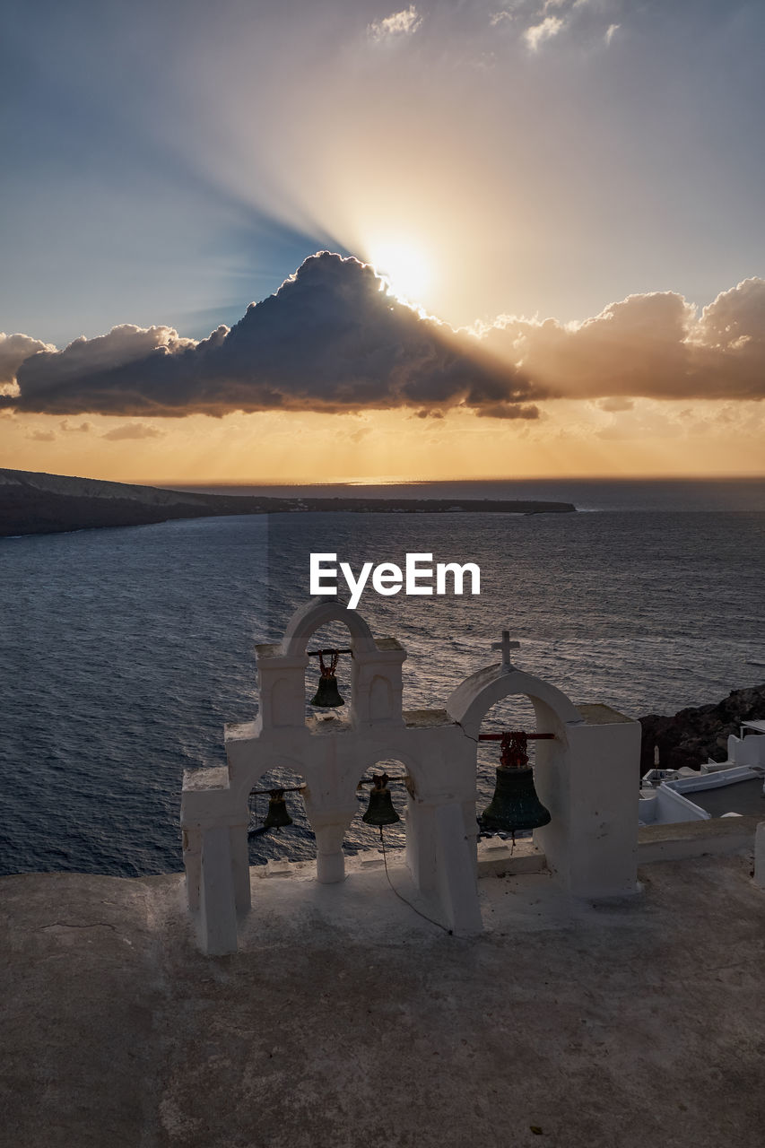 scenic view of beach against sky during sunset