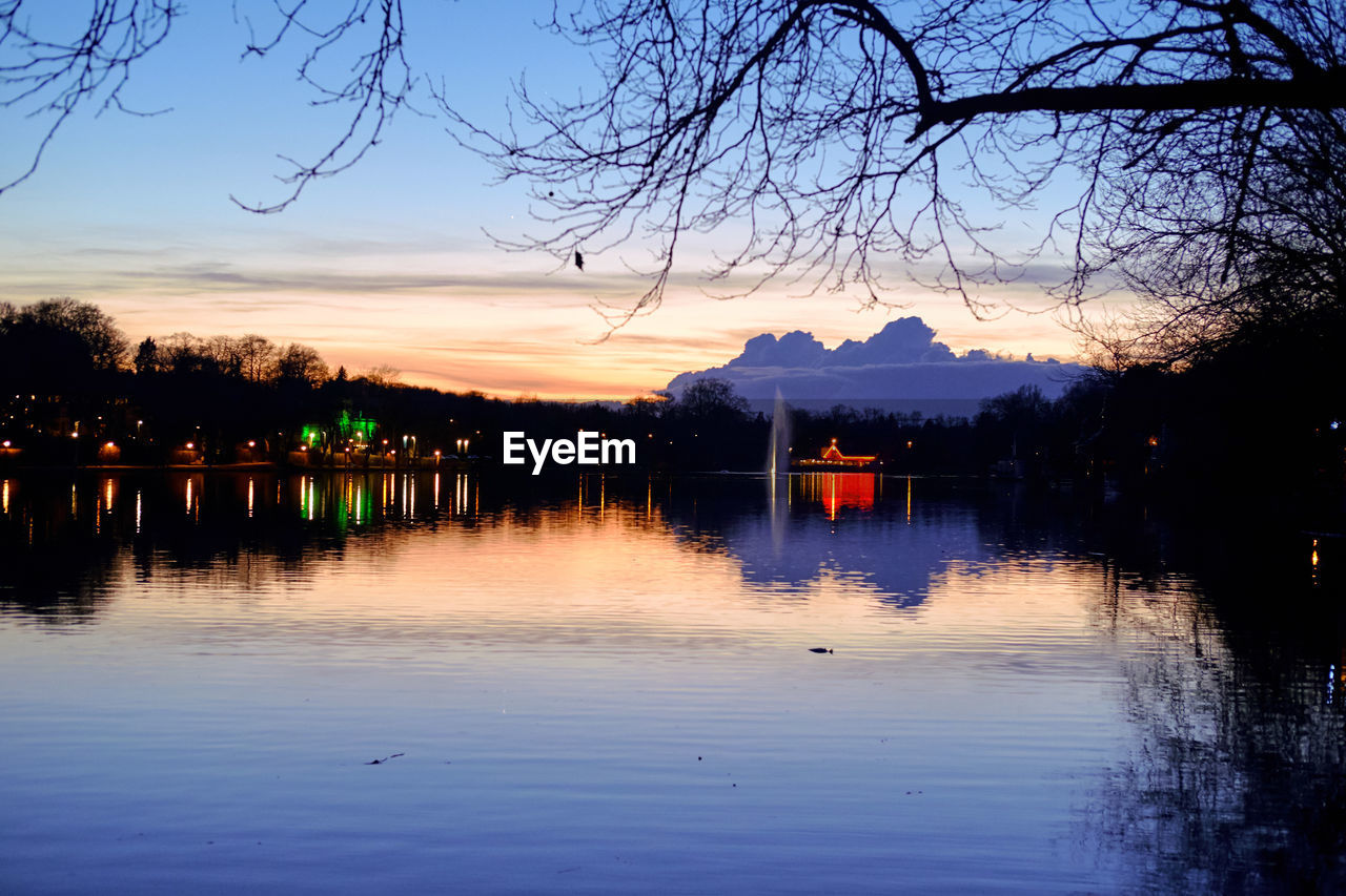 SCENIC VIEW OF LAKE BY SILHOUETTE TREES AGAINST SKY