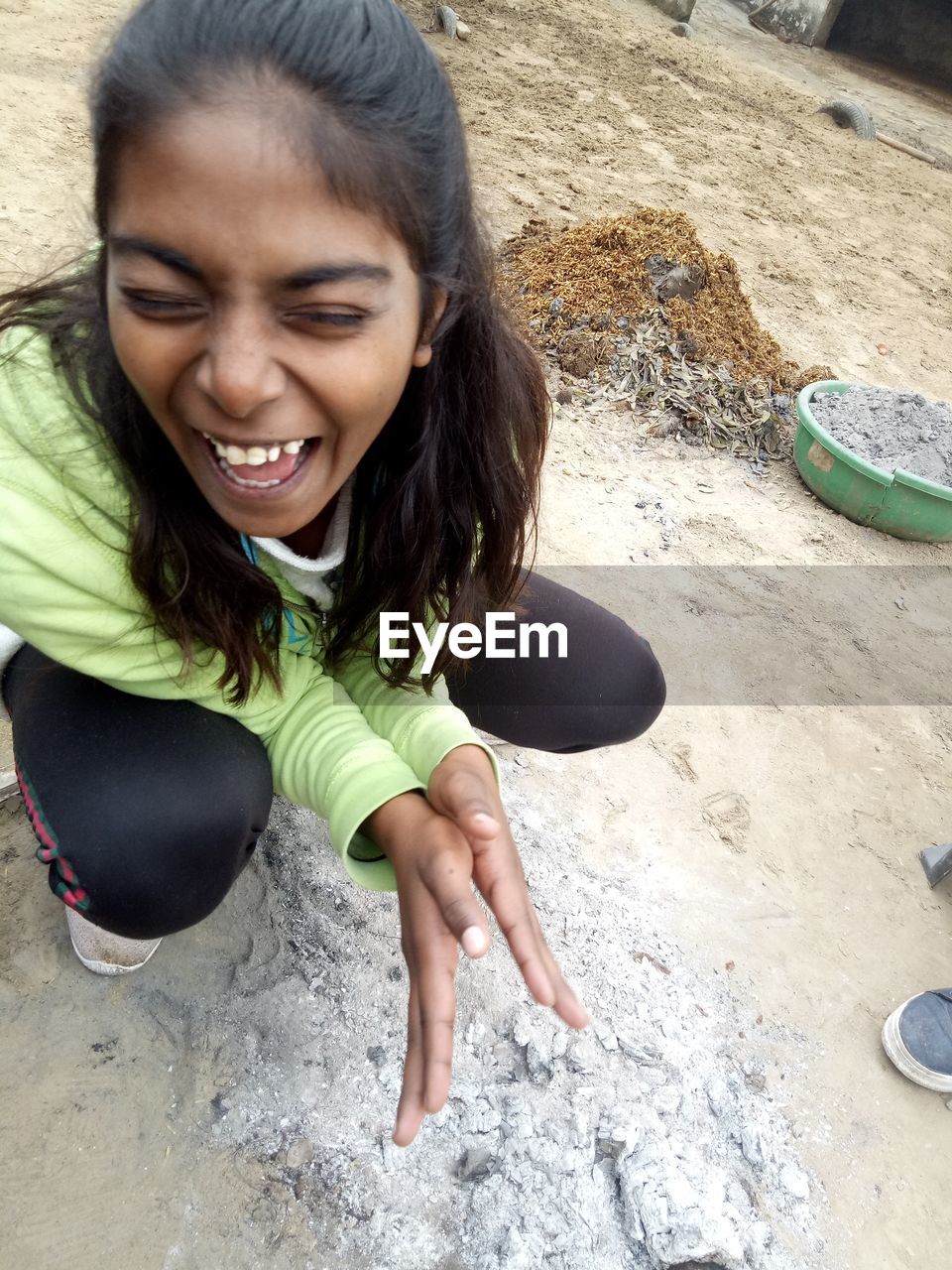 HIGH ANGLE VIEW OF WOMAN ON ROCK
