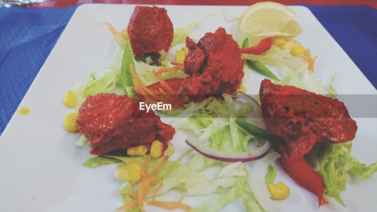 High angle view of meat served in plate on table