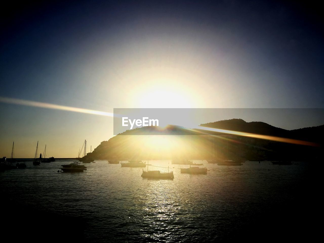 SCENIC VIEW OF SUNSET OVER SEA