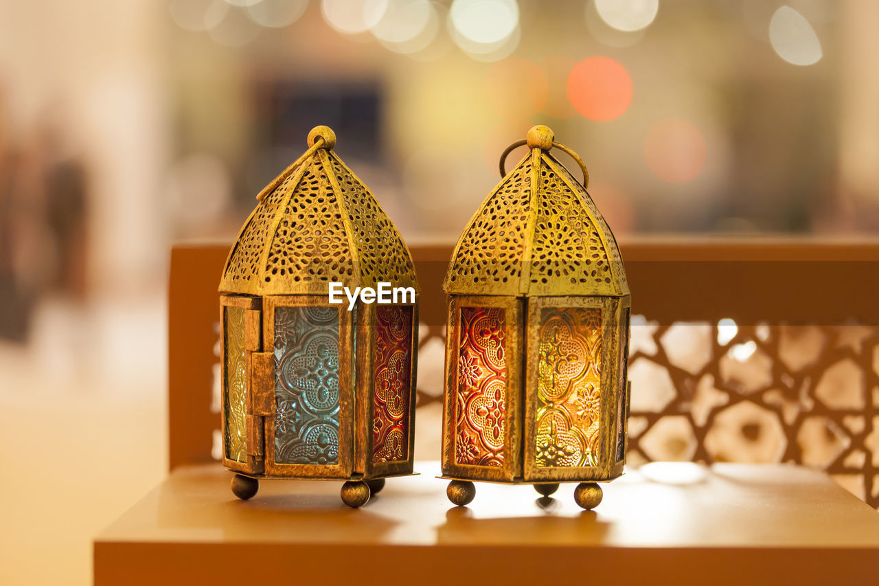 Close-up of illuminated lanterns on table