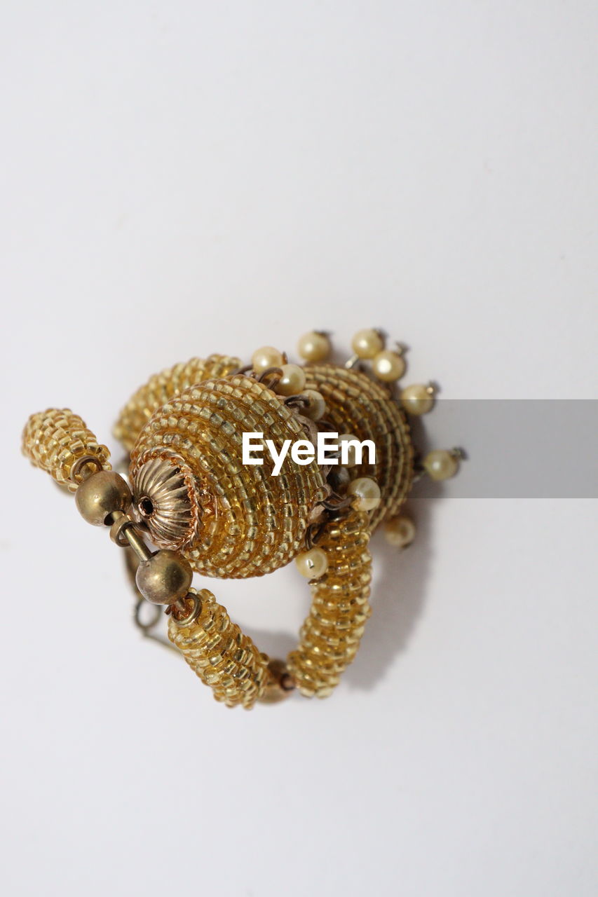 CLOSE-UP OF GOLD COLORED BACKGROUND