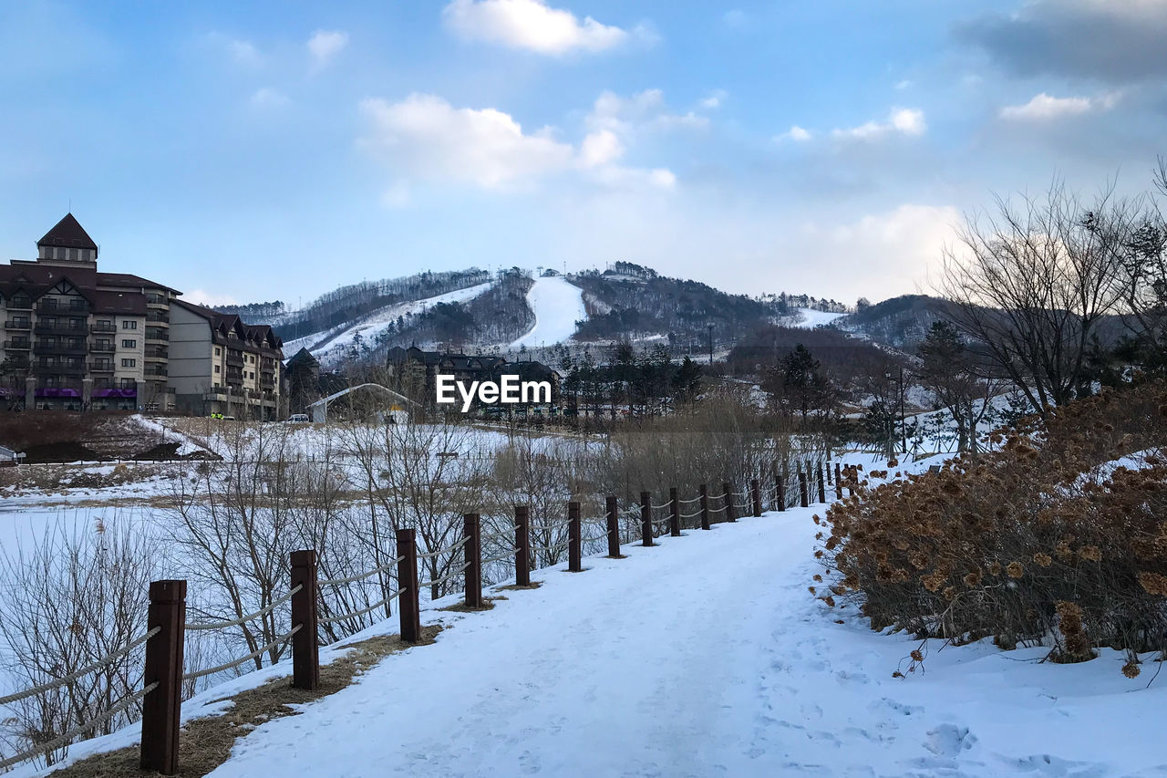 Scenic view of alpensia ski resort against cloudy sky, pyeongchang, south korea