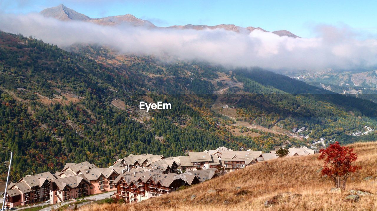 Scenic view of landscape and mountains against sky