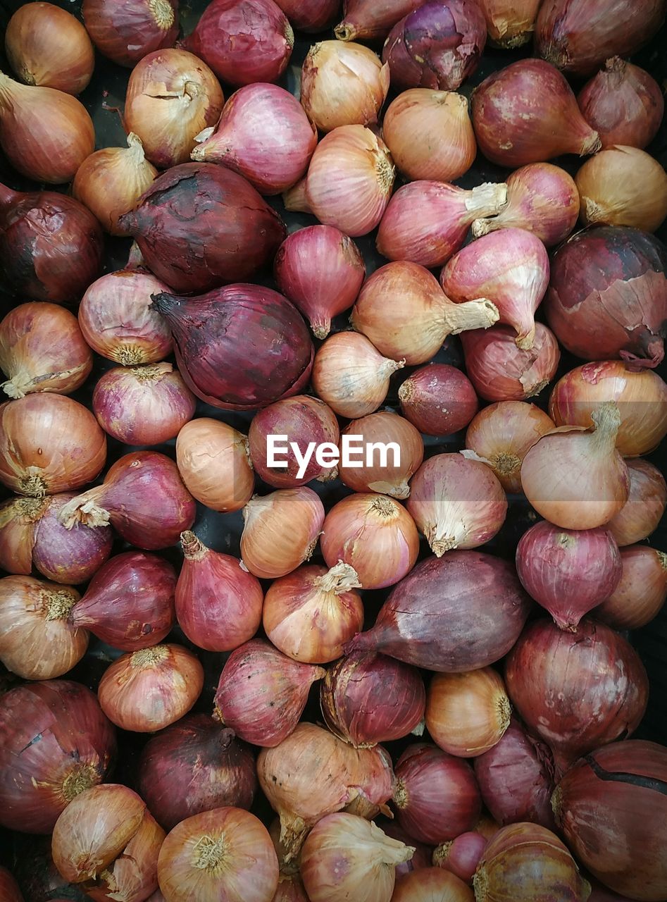 Full frame shot of onions for sale at market stall