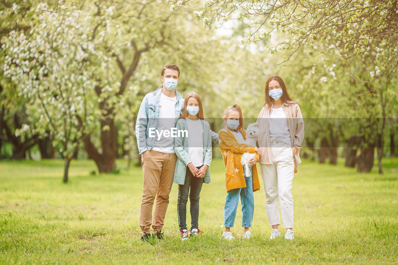 Full length of father with daughter against plants