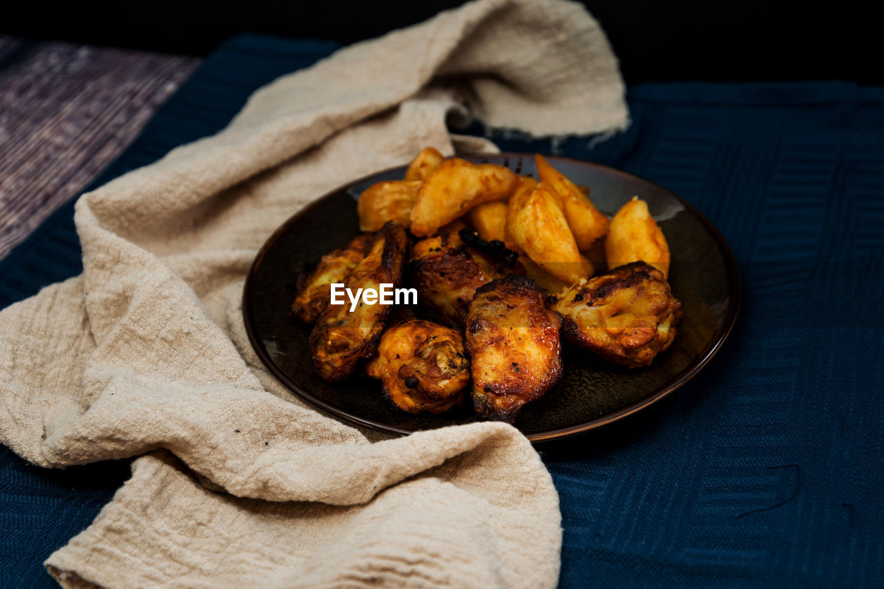 High angle view of meat in plate on table