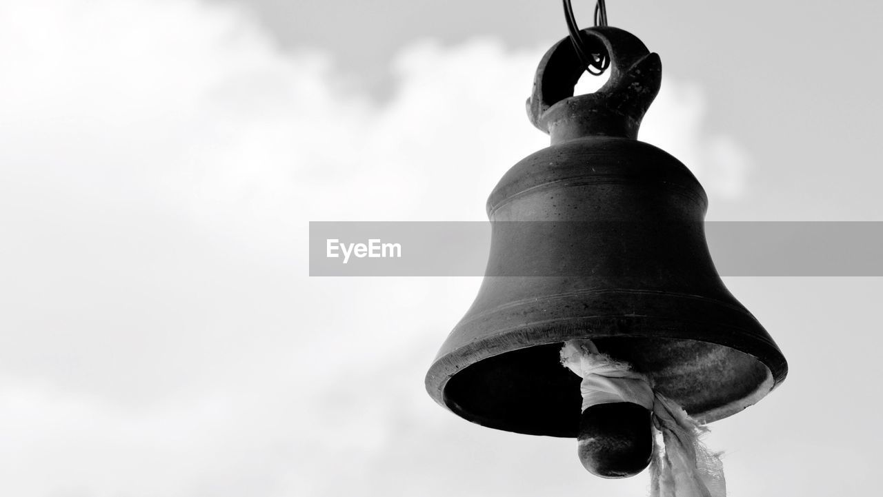 Close-up of bell against sky