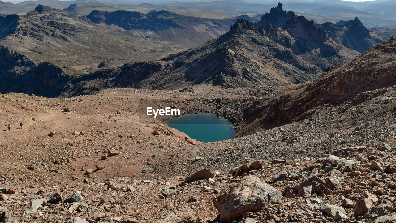 Volcanic craters and small lakes above the clouds at mount kenya