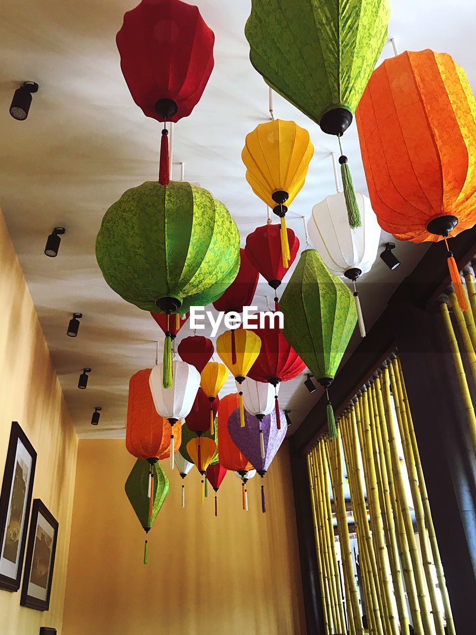 LOW ANGLE VIEW OF LANTERN HANGING ON CEILING