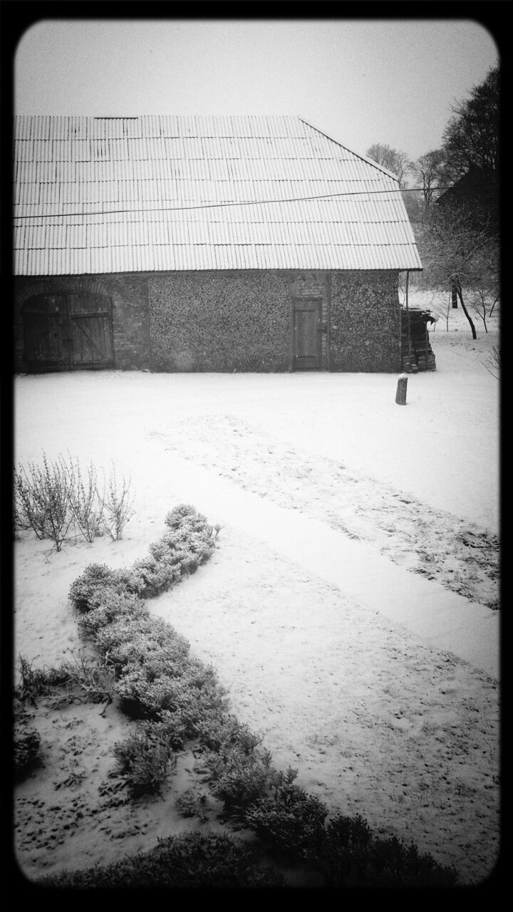 Barn on snow covered farm