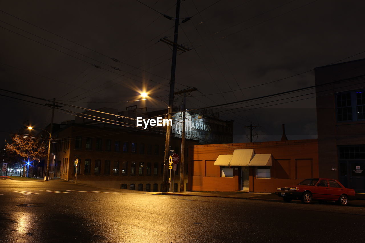 ILLUMINATED CITY STREET AT NIGHT